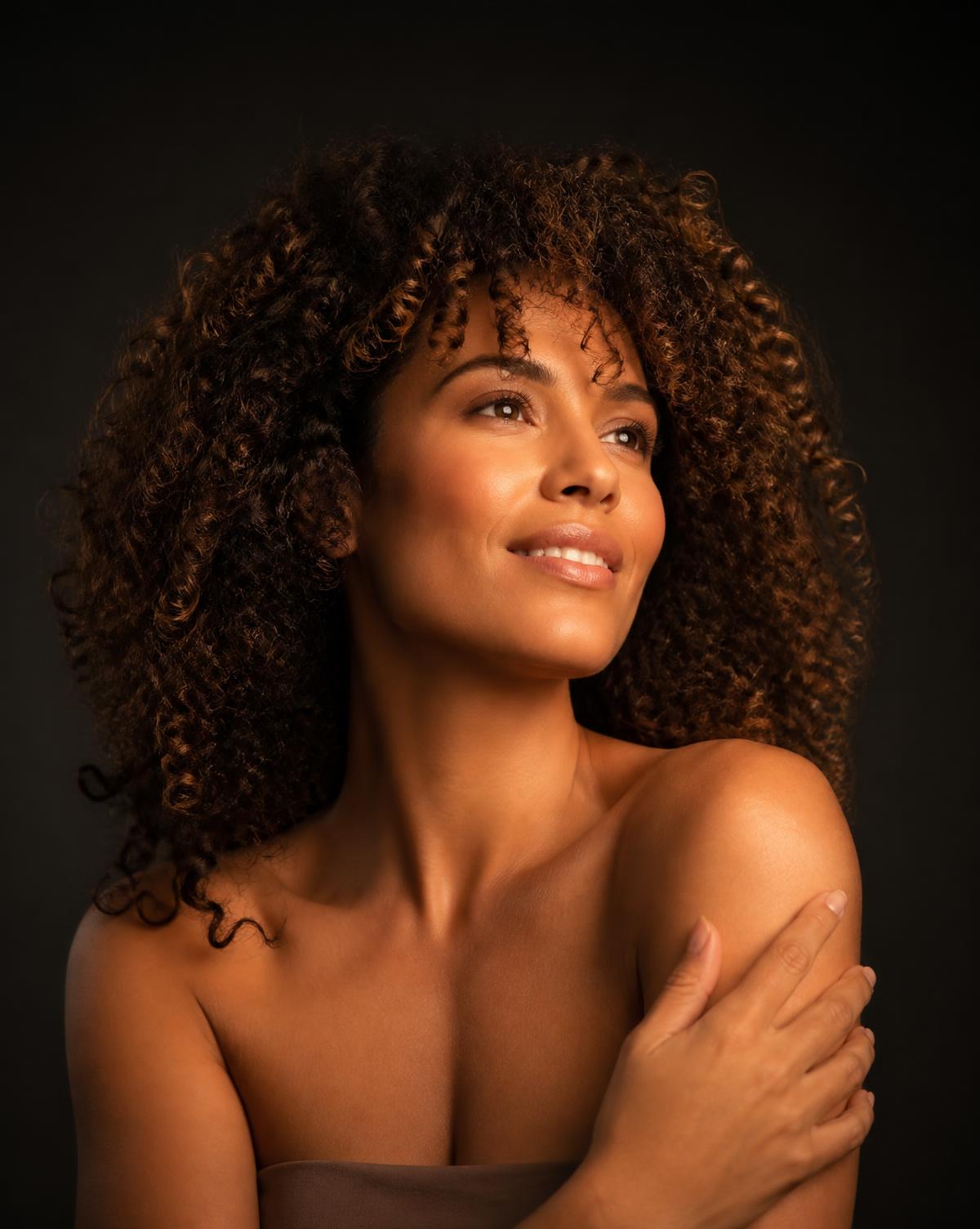 A woman with healthy, full hair looking confident and hopeful